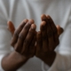 A women with open hands indicating that she is praying