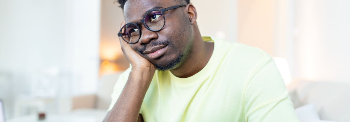 Close up profile view of pensive upset African American man look in distance thinking of personal problems, thoughtful sad biracial male feel depressed lost in thoughts pondering, having dilemma