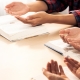 Diversity people hand praying faithfully together on bible book. Burgeoning.