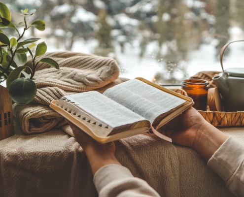 Girl holding a Bible, morning prayer and worship. biblical self-love