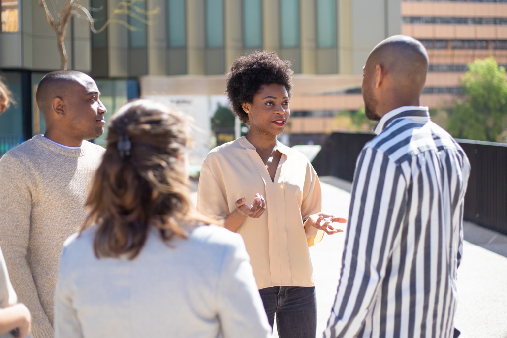 Group of young friends standing on street and communicating. Is this godly counsel